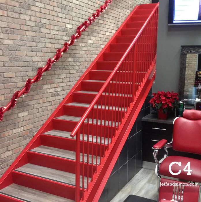 Commercial stainless steel and glass railing system fabricated by Jeff and Simon Ironworks for Metro Vancouver