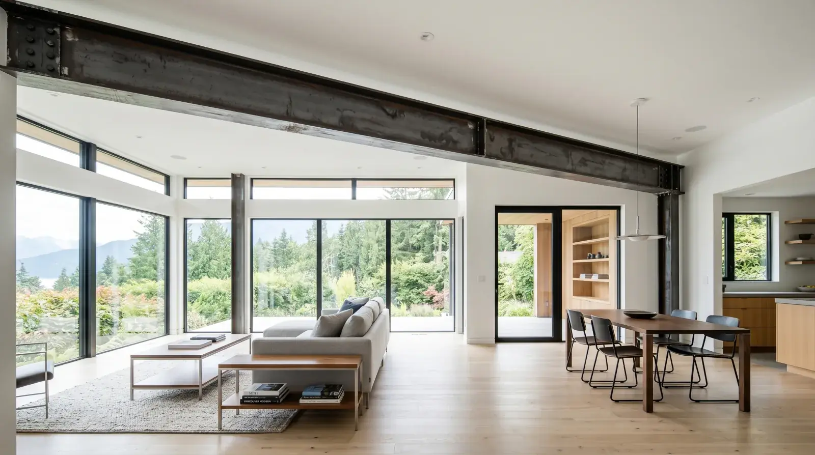 Exposed structural steel I-beam with hot-rolled mill scale finish spanning an open ceiling in a Vancouver modern home