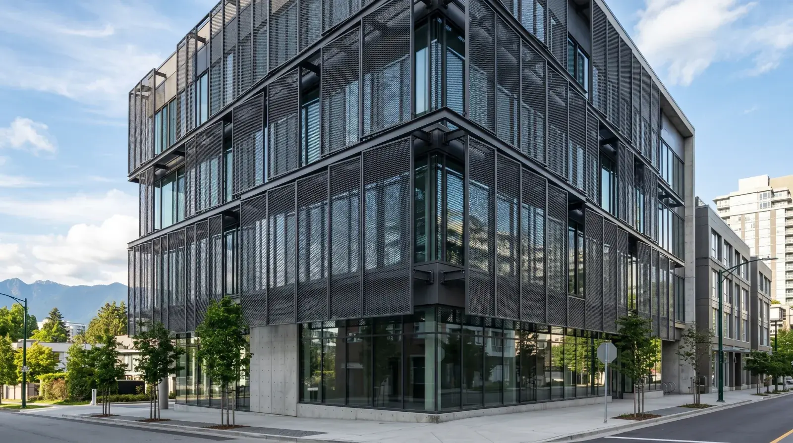 Architectural expanded metal mesh screen wrapping a modern Vancouver commercial building facade