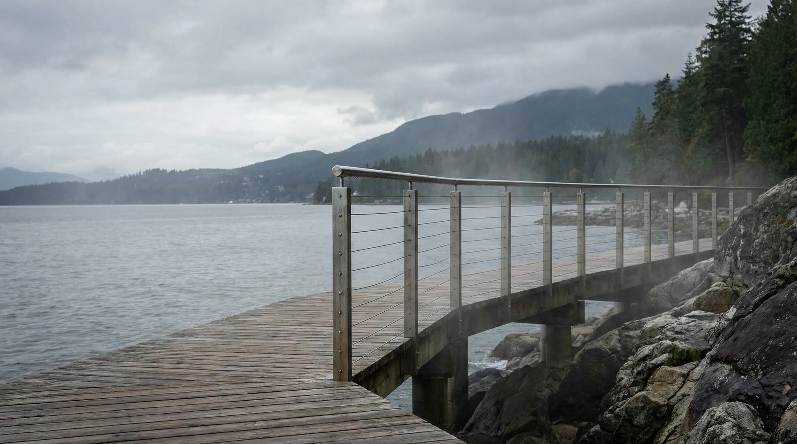 Marine-grade 316L stainless steel cable railing along a waterfront walkway in West Vancouver