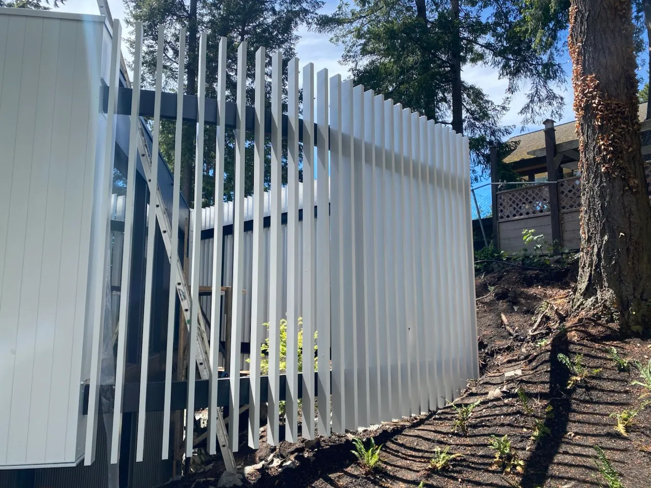 Custom steel driveway gate fabricated by Jeff and Simon Ironworks for a Vancouver residential property