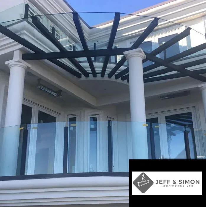 Custom steel pergola canopy with glass railing on luxury Vancouver residence balcony