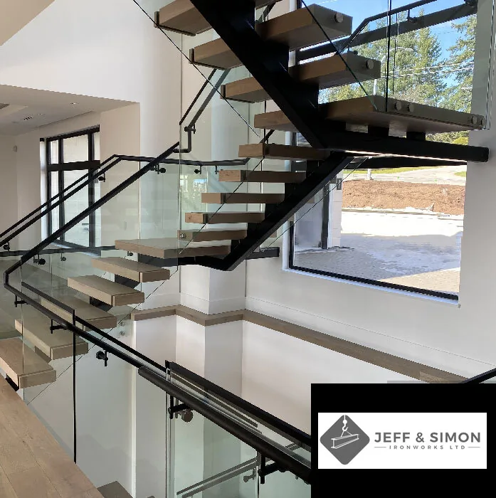 Modern floating staircase with steel mono-stringer, wood treads, and glass railing in Vancouver home