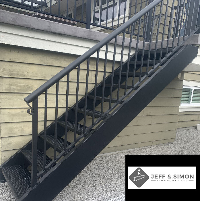 Exterior steel staircase with vertical bar metal railing on Vancouver residential building